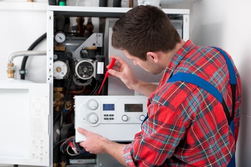 Gas Safe engineer working on a boiler in Peckham